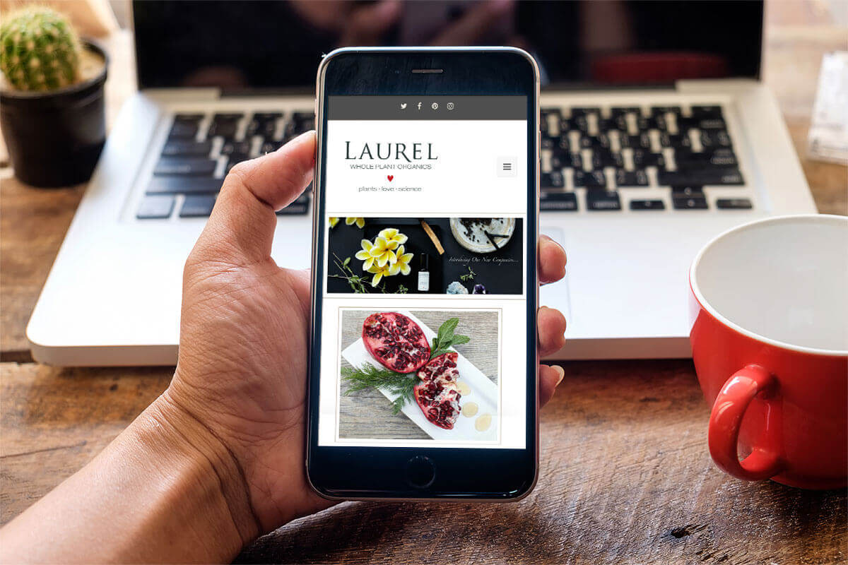 Smartphone displaying Laurel Whole Plant Organics homepage